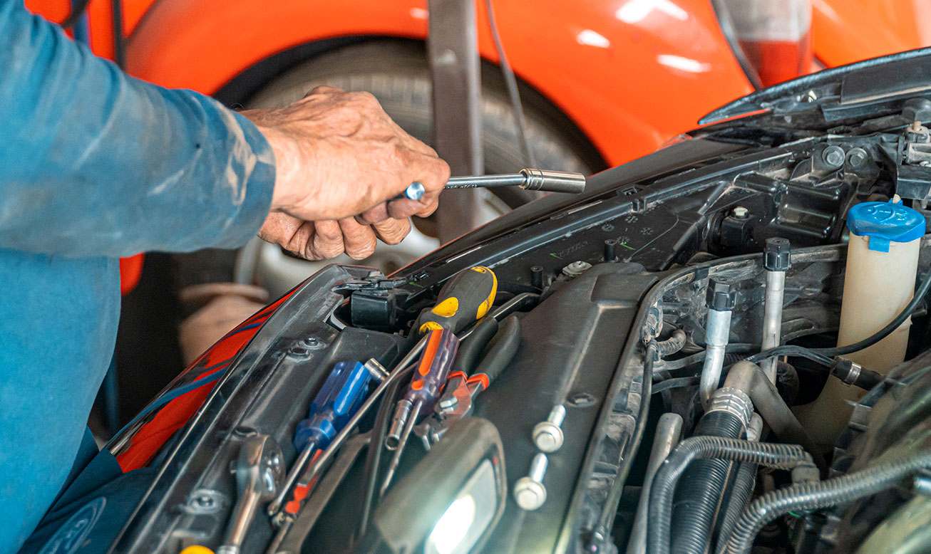 Mechanic Working on Car 2 Mechanic Working on Car 2